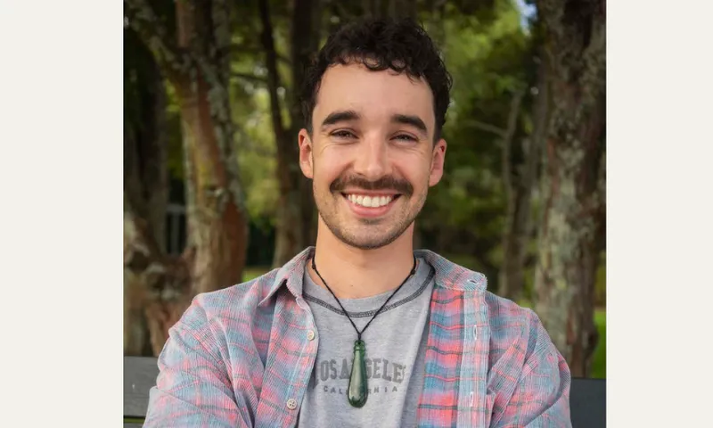 Director Joe Canham smiles directly at the camera.