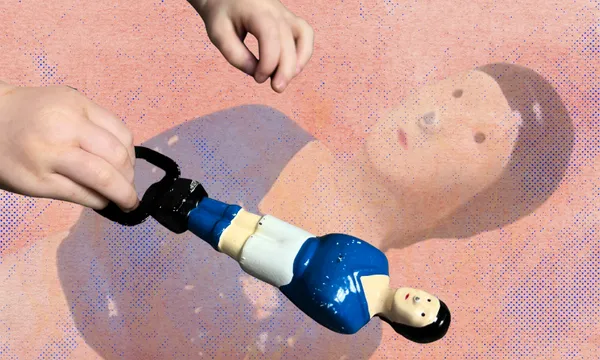 A hand holds a small foosball player figurine with a blue shirt and white shorts. The figure casts a detailed shadow on a textured background, resembling the player's face. Another hand reaches toward the figurine.