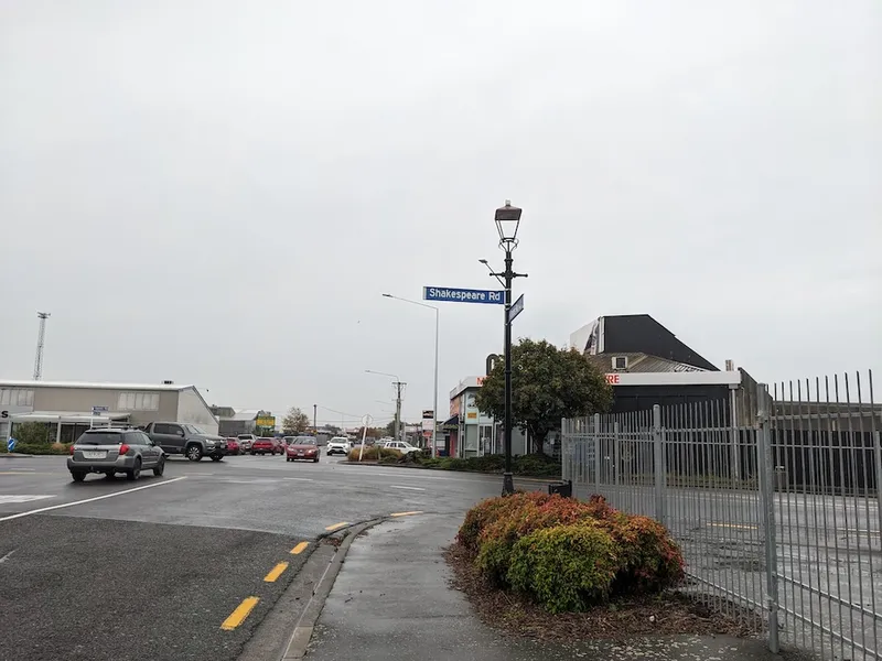 a grey grey street with a street sign saying "shakespeare Road". Chilly Christchurchi n Autumn/I forgot to do the reading for first year English class emanate from the photograph