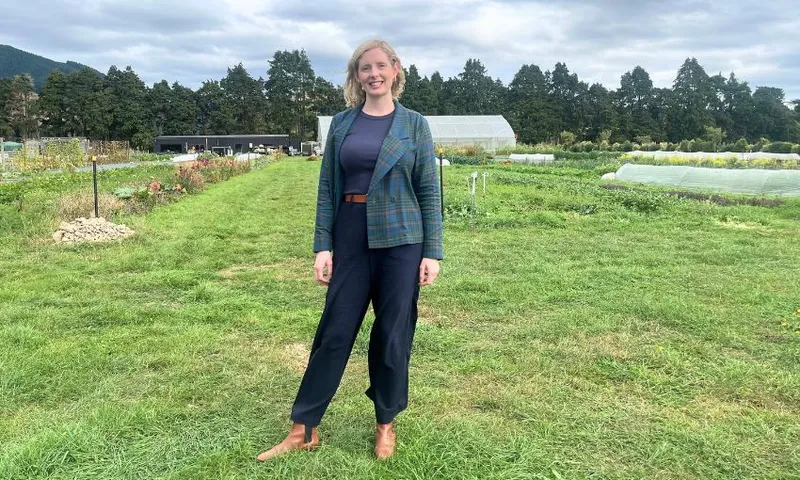 Mayoral hopeful Peri Zee stands in the middle of Mangaroa Farm.