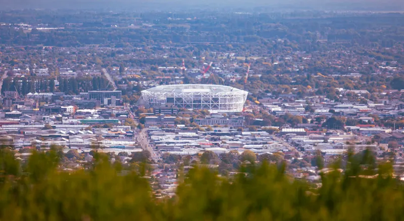 Christchurch Central City from the Port Hills Summit Road. Te Kaha Stadium