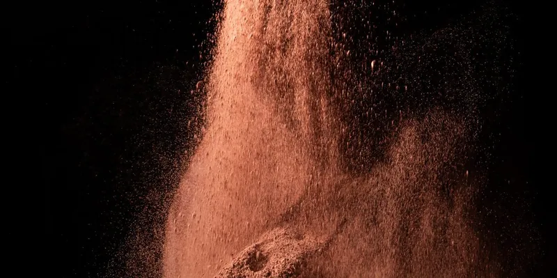 photograph of falling red pigment