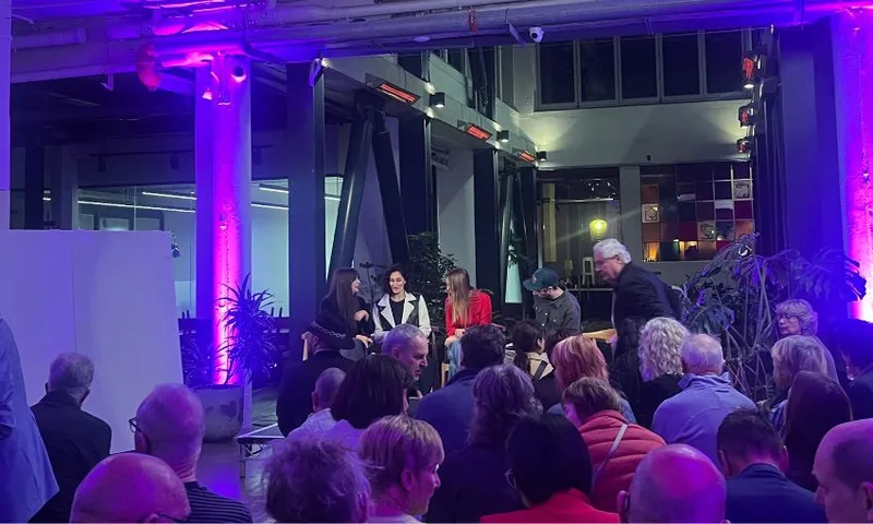 A small crowd listens to Vision for Wellington panellists inside The Exchange.