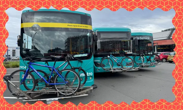 three buses with bike racks and a orange and yellow zany border around it