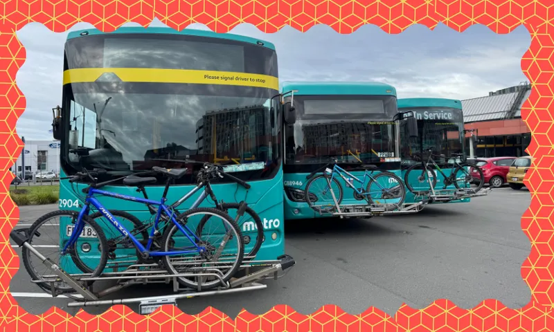 three buses with bike racks and a orange and yellow zany border around it