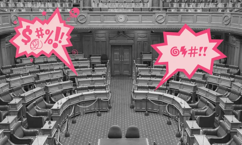A black-and-white photo of an empty parliamentary chamber with two large, pink cartoon speech bubbles containing symbols representing shouting or swearing.