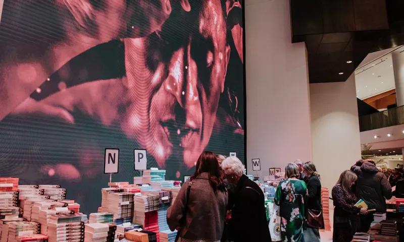 People buying books at AWF25 - 1