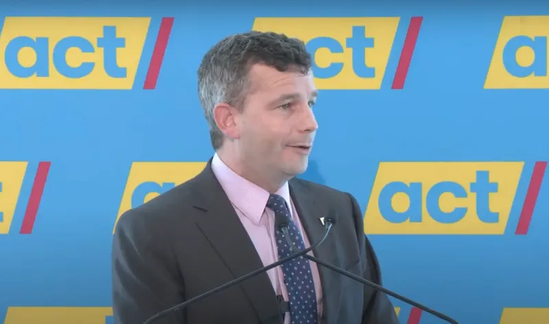 David seymour with act party banner