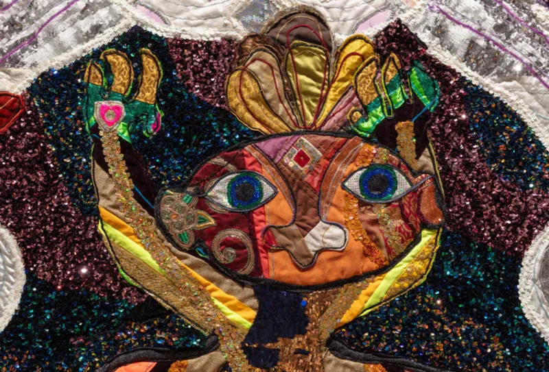 A colourful detailed and sequinned quilt