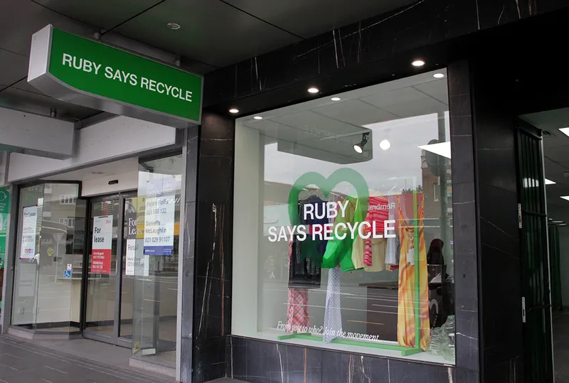 shop front with green sign saying Ruby says recycle