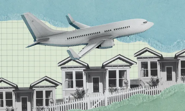 A grayscale aeroplane flies above a row of small houses with white fences, set against a graph paper background with blue and green torn paper textures.