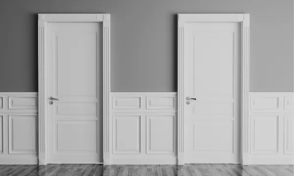 a black and white image showing two closed white office doors