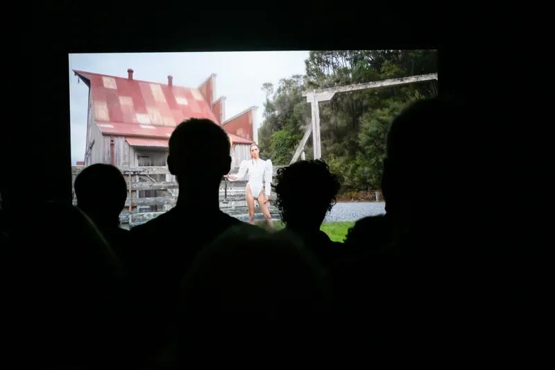 people looking at a barn