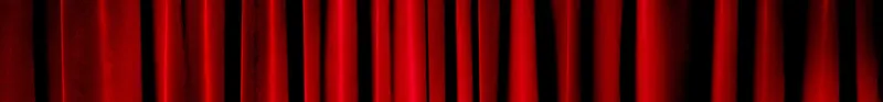 Darkly lit theatre curtains