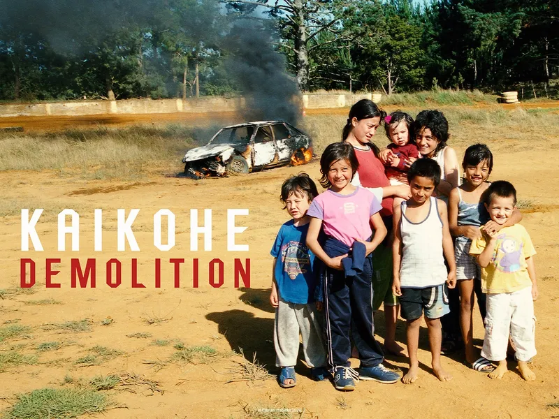group of kids in front of burning out car