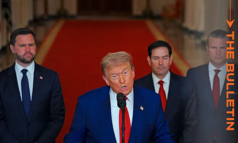 A man in a blue suit speaks at a podium with a microphone, flanked by three men in suits. They stand on a red carpet in an ornate hallway. "THE BULLETIN" text appears vertically on the right.
