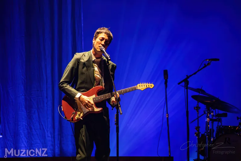 photo of marlon williams playing a red guitar