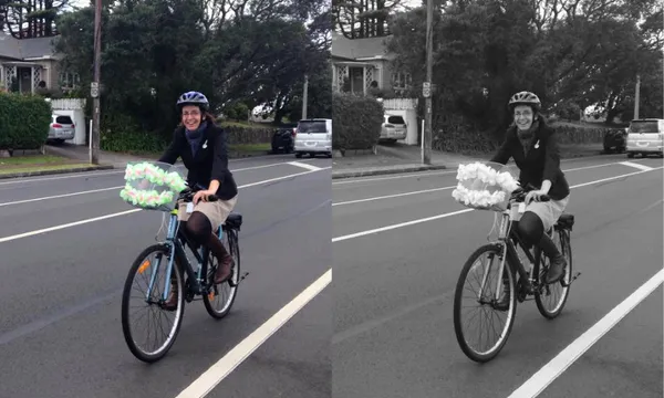 Two identical images of a woman in a dark coat and beige skirt cycling on an empty suburban street