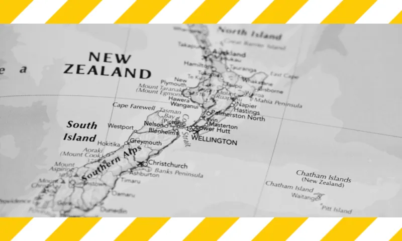 Map of New Zealand in black and white with yellow and white tape across the top and bottom of the image