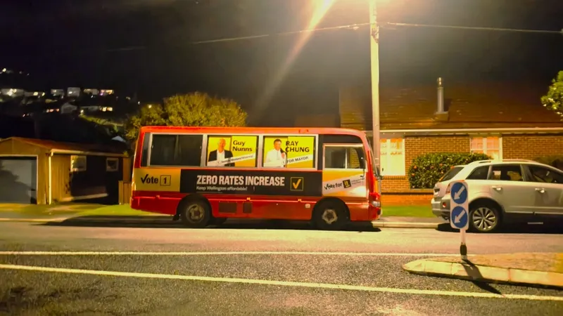 A red bus parked on a suburban street