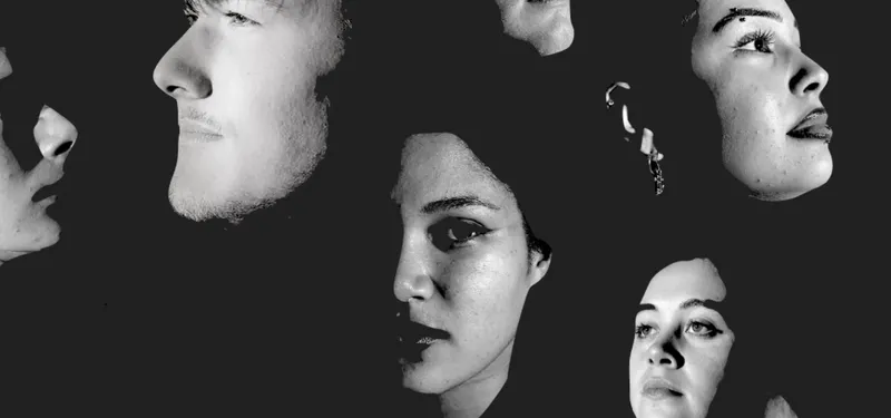 faces pn a black background