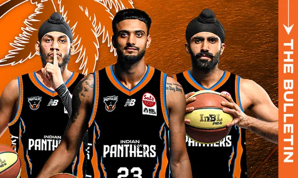 Three male basketball players wearing black Indian Panthers jerseys stand side by side against an orange background with a palm leaf design. One holds a basketball, while another makes a finger-to-lips gesture.
