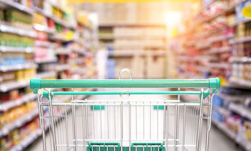 a supermarket trolley going into an empty aisle