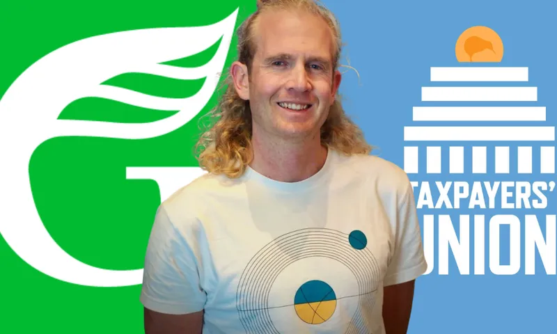 A man with long blond hair in a white t shirt, standing in front of a green and blue background.