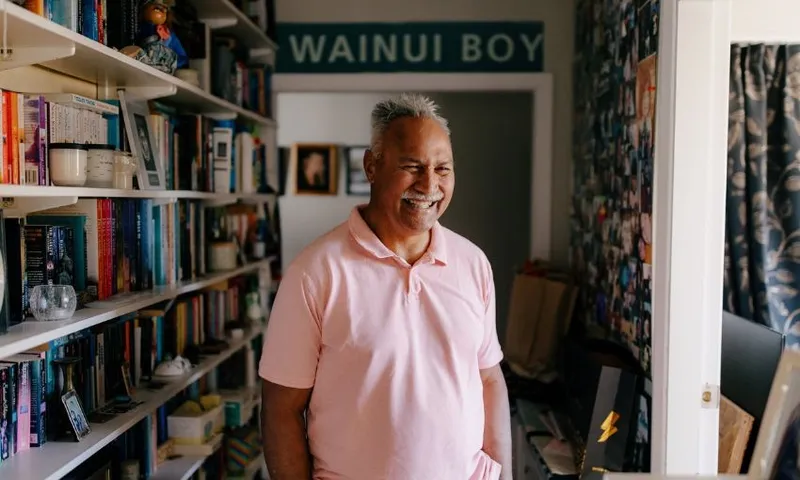 Laban, photographed at home in front of a sign reading "Wainui Boy"