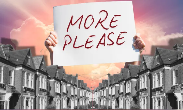 Hands hold a sign reading "MORE PLEASE" above a street lined with identical houses, with a dramatic sunset sky in the background.