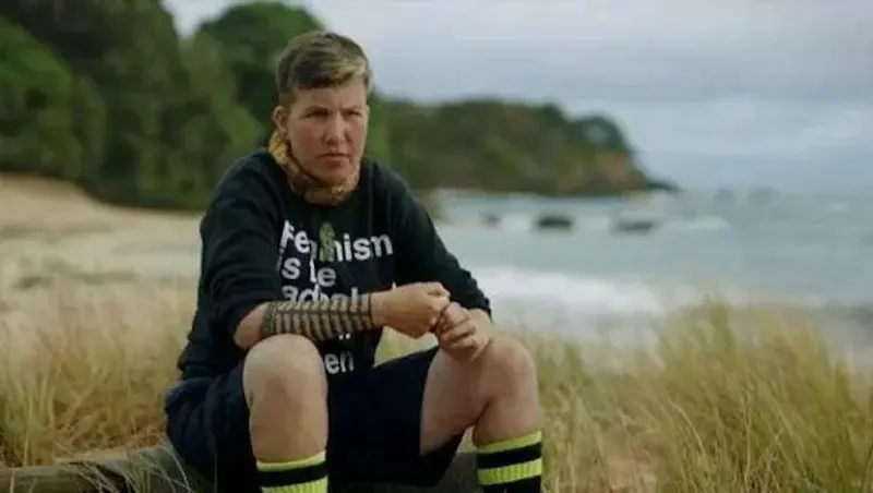 Karen O'Leary sits on a Northland beach on Celebrity Treasure Island