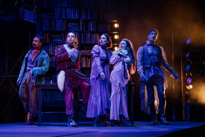 three men and two women in 19th century formalwear stand on a stage in a performance of Mary: The Birth of Frankenstein