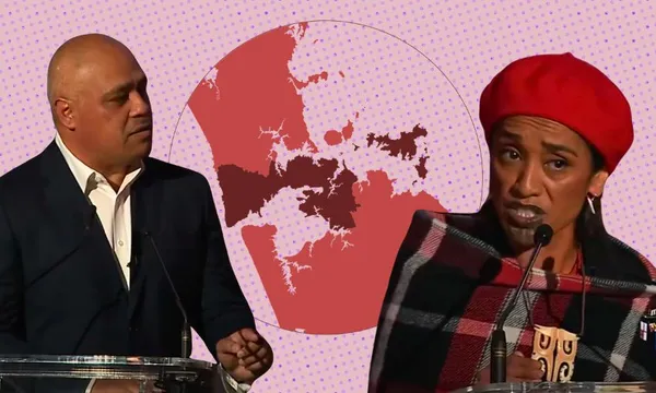 Cut outs of Peeni Henare and Oriini Kaipara standing in front of a map of the Taamaki Makaurau electorate.