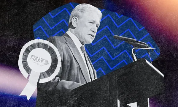 A grayscale image of a man in a suit speaking at a podium with a microphone. A “New Zealand First” ribbon is to the left. The background features blue zigzag lines and colorful light flares.