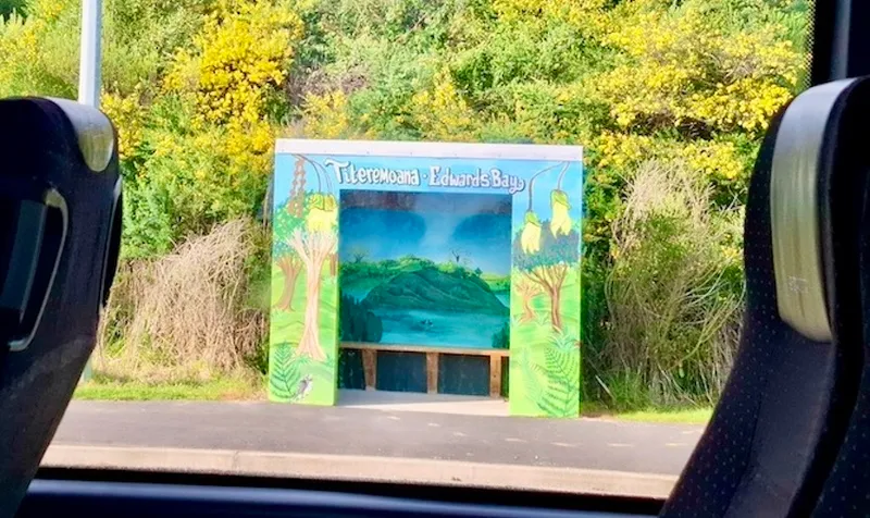 Image of a coloufully painted bus shelter located on the Dunedin peninsula