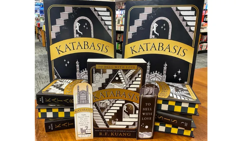 A display of the book Katabasis by R.F. Kuang. It shows hardcover and paperback books as well as book marks.