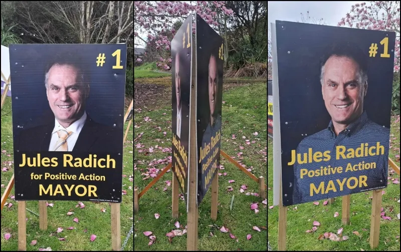Three election campaign signs for Jules Radich, running for mayor. The photos show the signs from the front and side angles, featuring his portrait, campaign slogan, and the number 1. Trees and grass are in the background.