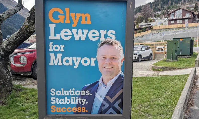 a blue sign and a white man in a suit with the slogan 'soloutions stability success'