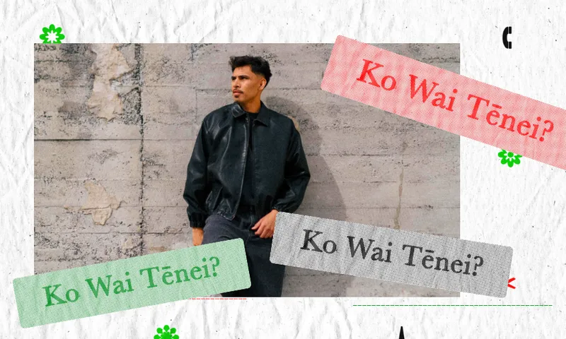 A man in a black jacket stands against a concrete wall. Overlaid text in green, red, and gray reads “Ko Wai Tēnei?” in a decorative style.