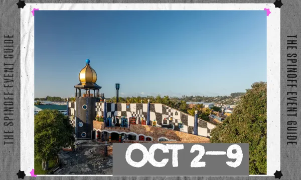 A photograph of the Hundertwasser Centre showing the building from an elevated vantage point. There is a fine sky above it.