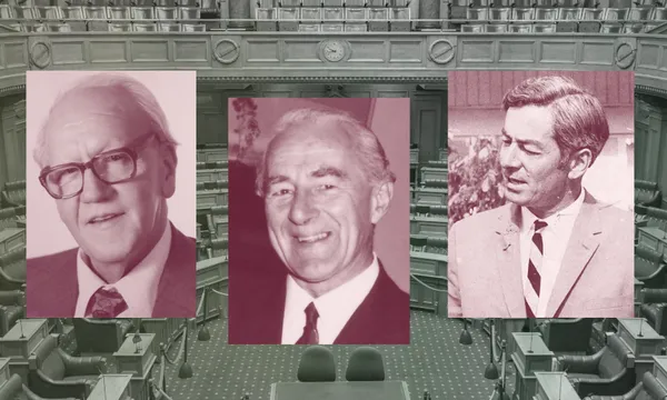 Three vintage portraits of men in suits are displayed in front of a black-and-white image of a parliamentary chamber with empty seats and desks.