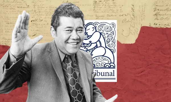 A smiling man in a suit raises his hand. Behind him is a document with signatures, a red section, and the Waitangi Tribunal logo featuring a Māori design.