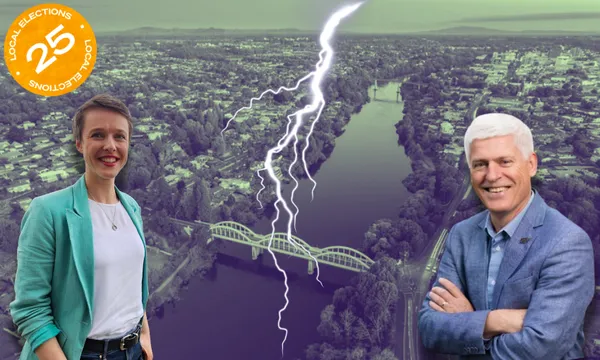 Two people, Sarah Thomson and Tim Macindoe, stand on opposite sides of a river with a bridge, facing each other. A bolt of lightning strikes between them. A "Local Elections 25" badge is in the top left corner. The background shows an aerial view of Hamilton.