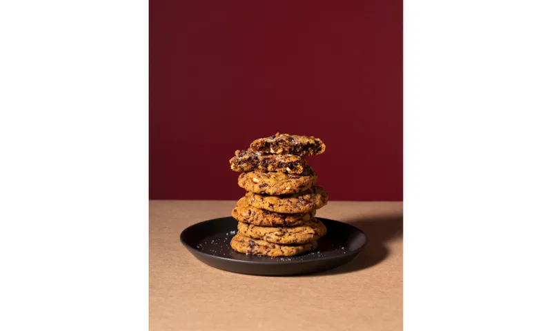 A photograph of a plate piled with cookies.