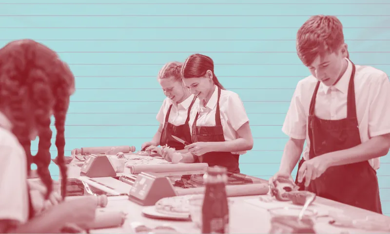 Four students in school uniforms and aprons work on cooking or baking projects at a table, using rolling pins and utensils. The background is light blue with horizontal lines.