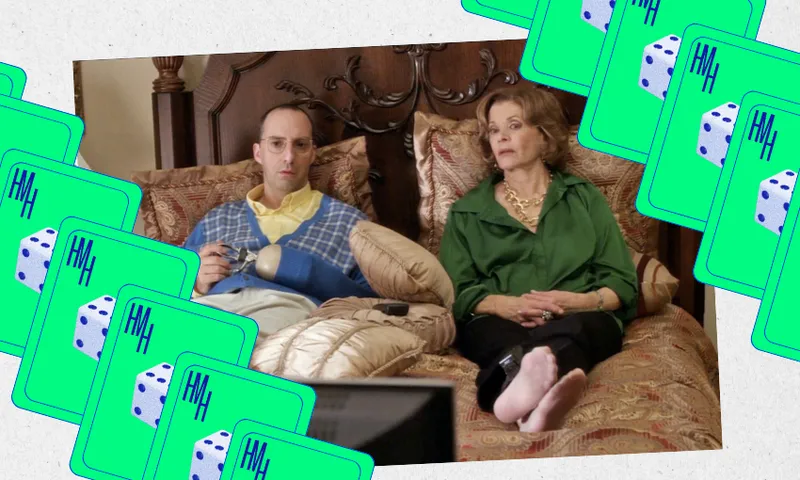 A man and woman sit on an ornate bed, looking expressionless at a TV. The man holds a teacup; the woman is barefoot. Green playing cards with dice illustrations border the scene.