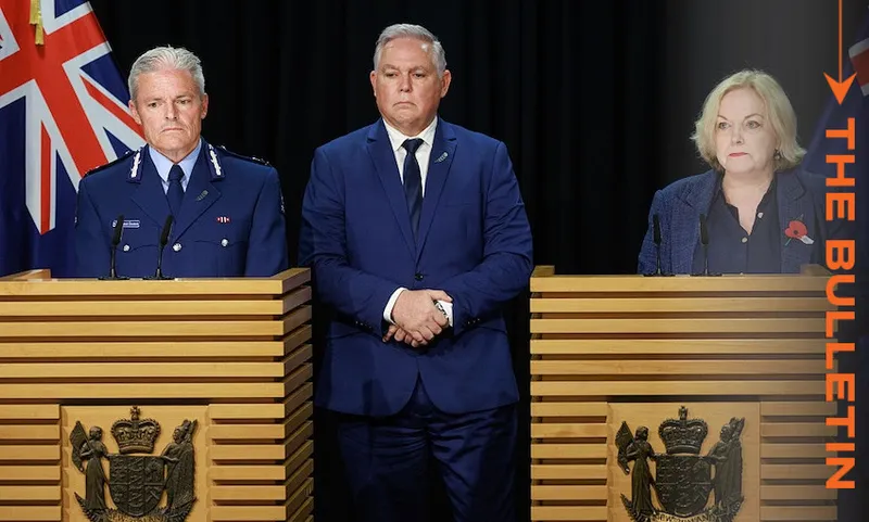 Three officials stand at podiums with New Zealand emblems in front of flags, giving a press conference. Two men are in suits and uniforms; one woman in a red top and light jacket. "THE BULLETIN" is written vertically on the right.