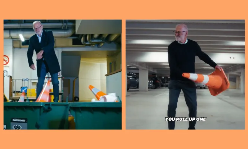 A man with glasses and a white beard interacts with orange traffic cones in a parking garage; on the left, he's tossing cones into a dumpster, and on the right, he holds a cone with the caption “YOU PULL UP ONE.”.