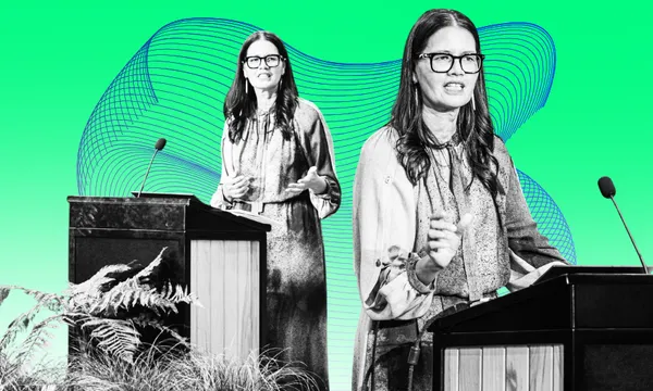A women stands at two separate podiums, appearing to debate or give speeches, against a bright green background with abstract blue lines. Both wear glasses and similar outfits, with plants in the foreground.