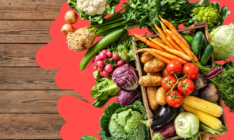 a pile of vegetables with some wood in the background